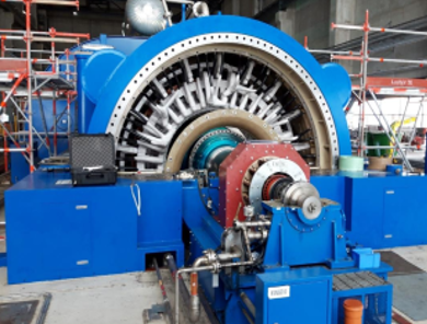 Blue industrial machine, a generator, with pipes and bolts.