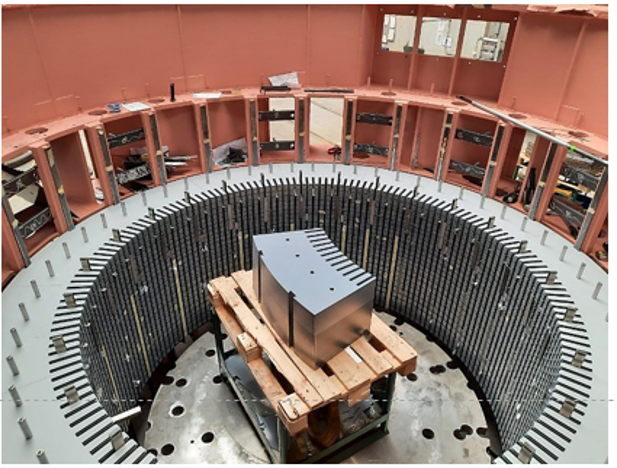Interior view of an electrical machine casing featuring a centrally placed component surrounded by stator laminations.