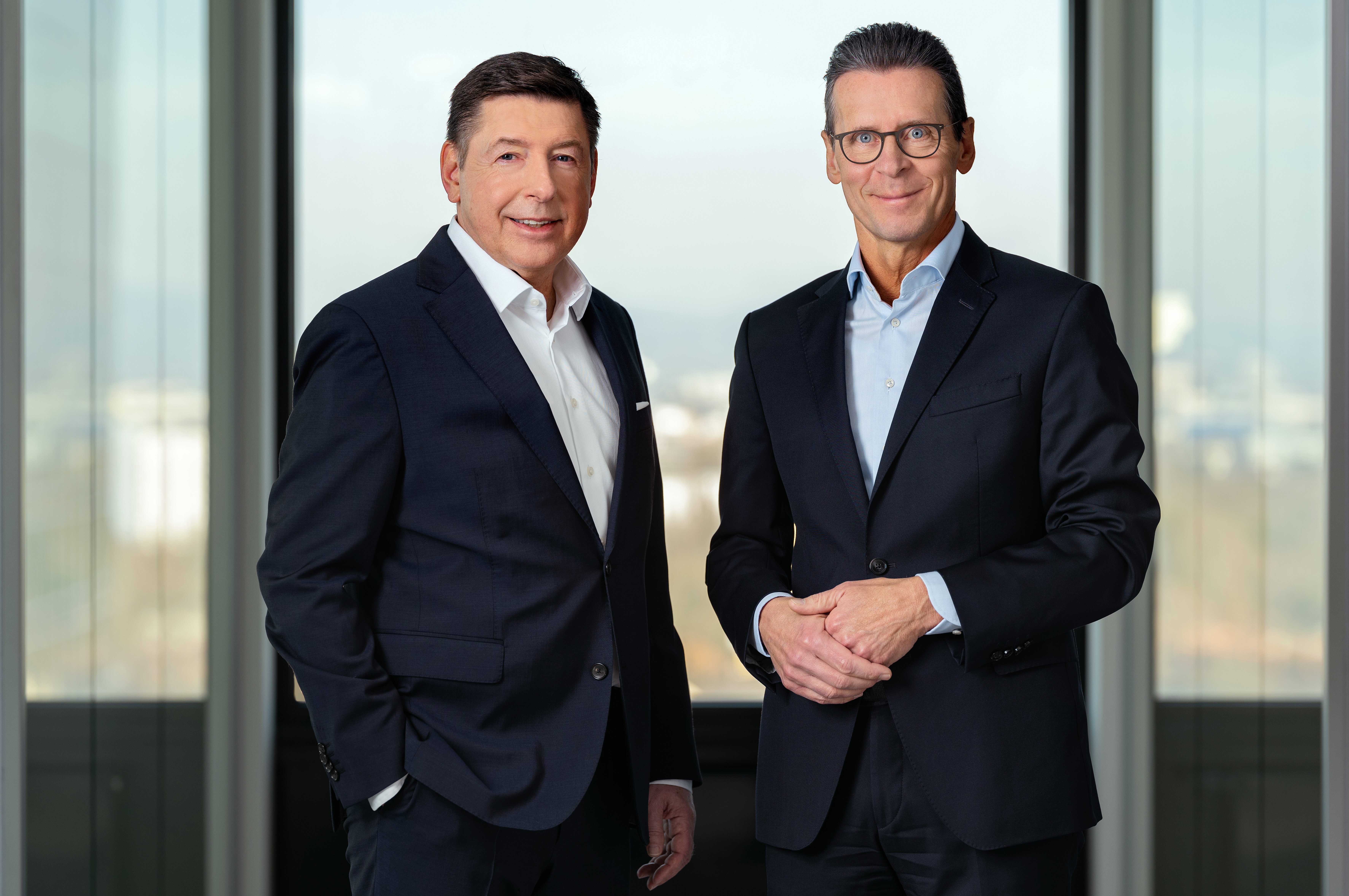  This image is a professional photograph featuring Dr. Thomas Schulz, Group CEO, and Matti Jäkel, Group CFO of Bilfinger, highlighting their leadership roles within the company. The setting conveys a sense of corporate professionalism and authority.