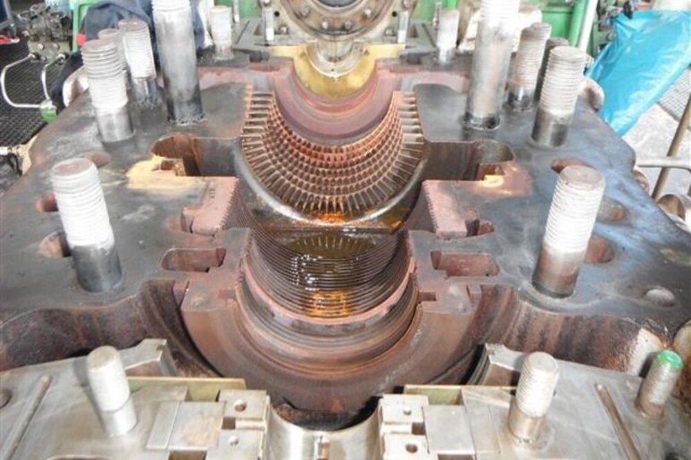 Detailed view of an open turbocompressor casing, revealing the intricate internal structure and blades.