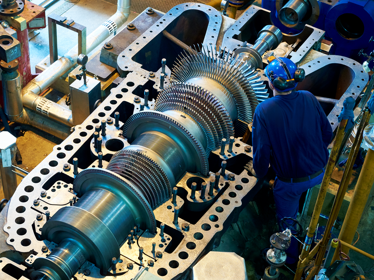 Turbomachine is being checked by a technician.